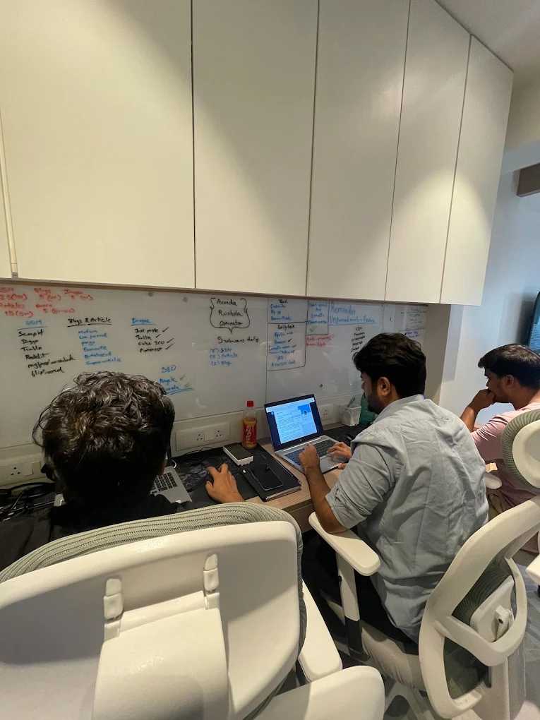 Beacon Minds team members working together at their desks