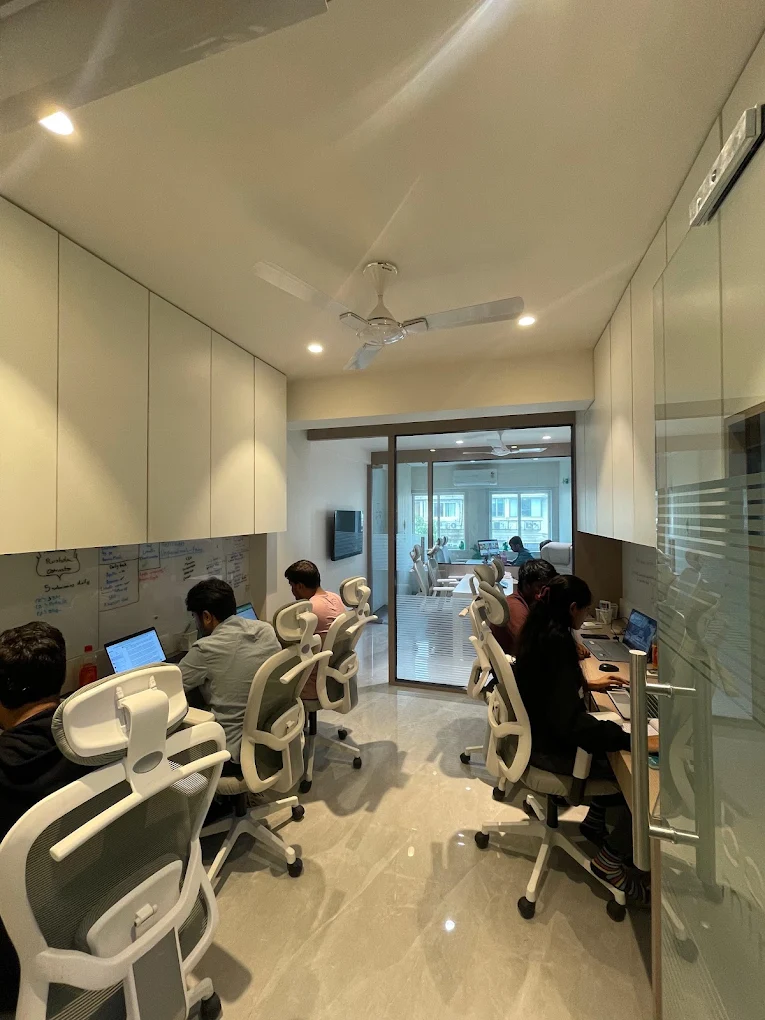 Beacon Minds office workspace with desks and team members