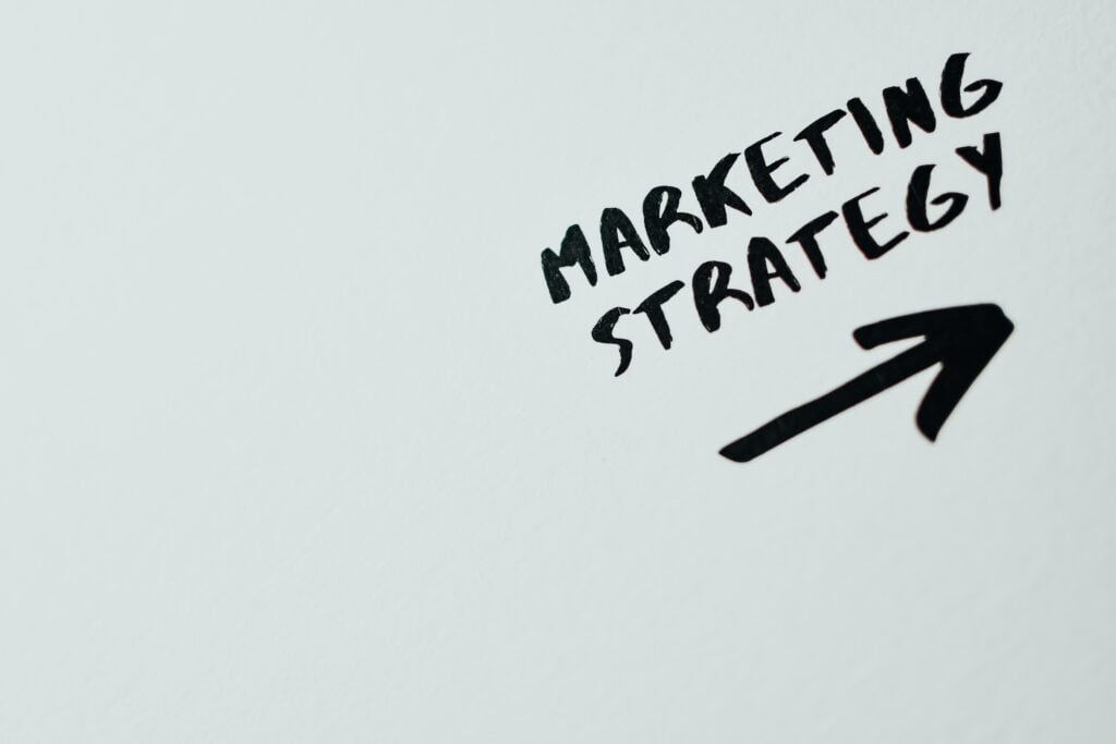 Marketing strategy written with black ink on white sheet
